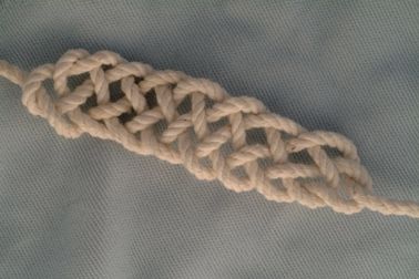 Five part chain knot, nine loops.