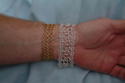 Two sizes of knotted chain mail in a bracelet.